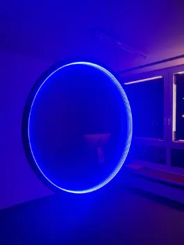 Light Art work. Blue circle with infinty illusion 