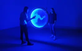 two people looking at an lightartwork by artist jacqueline hen 