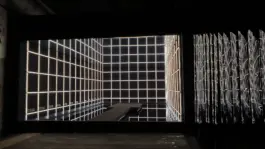 immersive light art installation that is an infinity illusion out of white and black grid. artwork by artist Jacqueline hen 