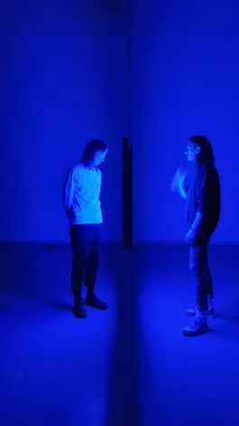 two people looking at an lightartwork by artist jacqueline hen 