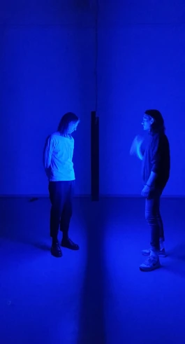 two people looking at an lightartwork by artist jacqueline hen 